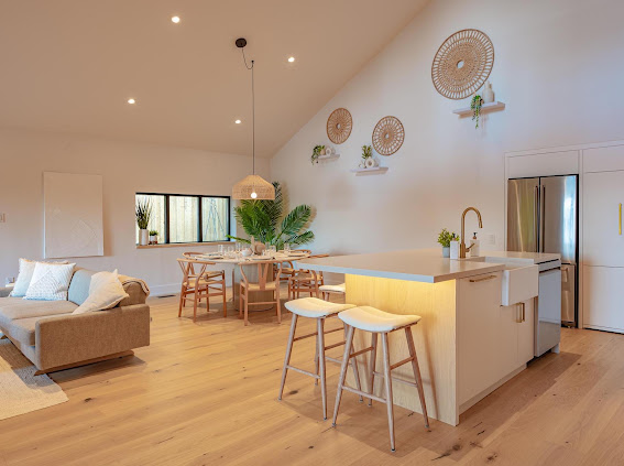 Open kitchen and living space with island and dining area